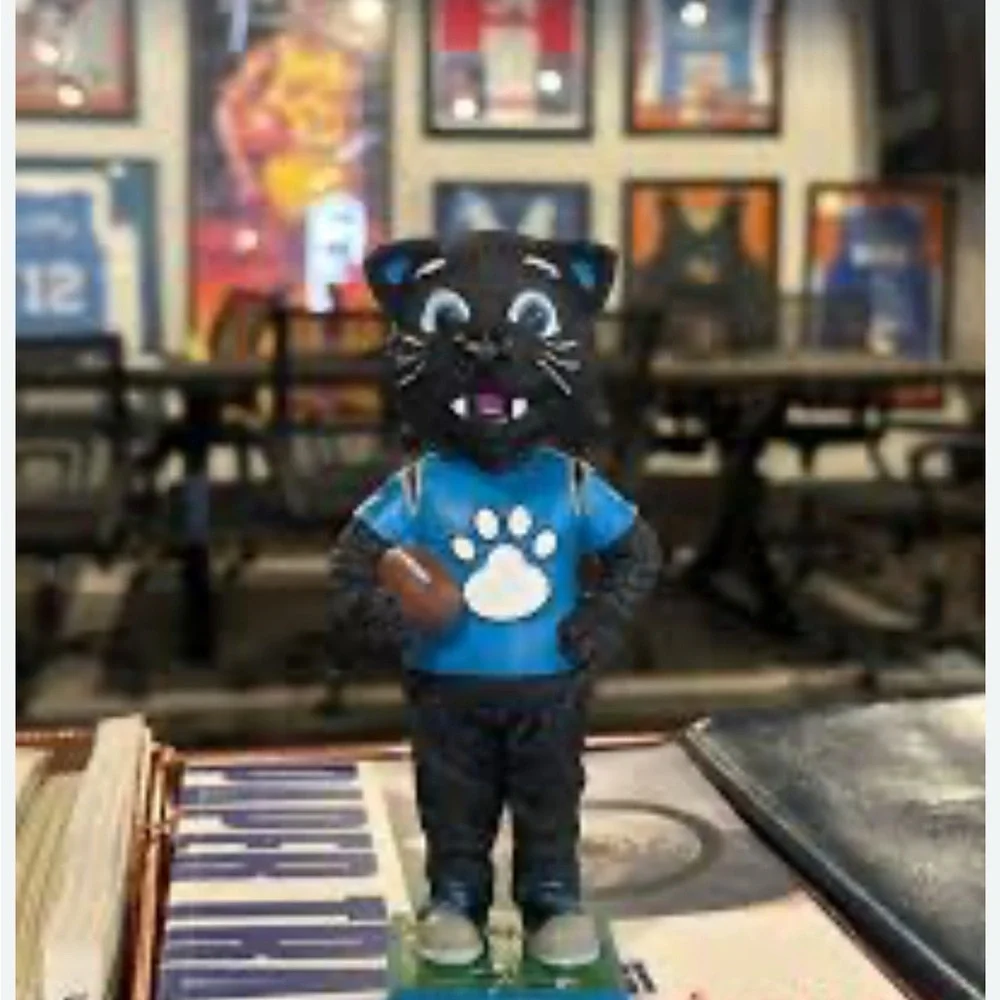 The item in the image is a Sir Purr Carolina Panthers mascot figurine/statue.